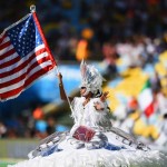 An Artist Performs During The Closing Ceremony with USA Flag