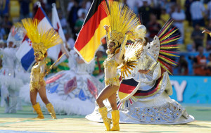 DANCERS PERFORM DURING IN FRONT OF A GERMAN FLAG