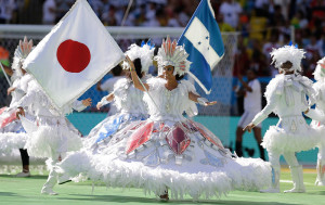 DANCERS PERFORM WITH A JAPANESE FLAG